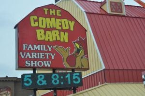 The Comedy Barn Theater sign
