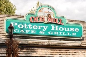 Sign for The Old Mill Pottery House Cafe & Grille.
