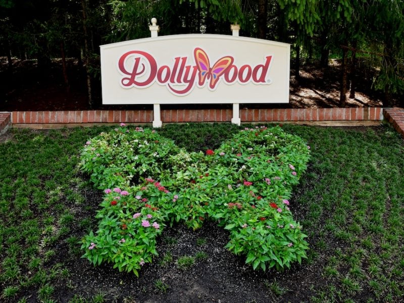 The Dollywood sign and a butterfly flower display.