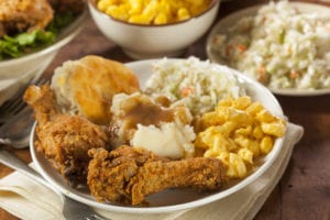 Fried chicken, mashed potatoes, coleslaw, mac and cheese, and a biscuit