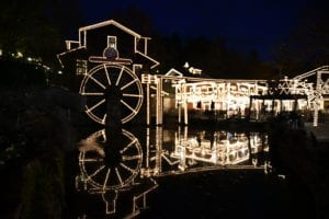grist mill at dollywood covered in lights